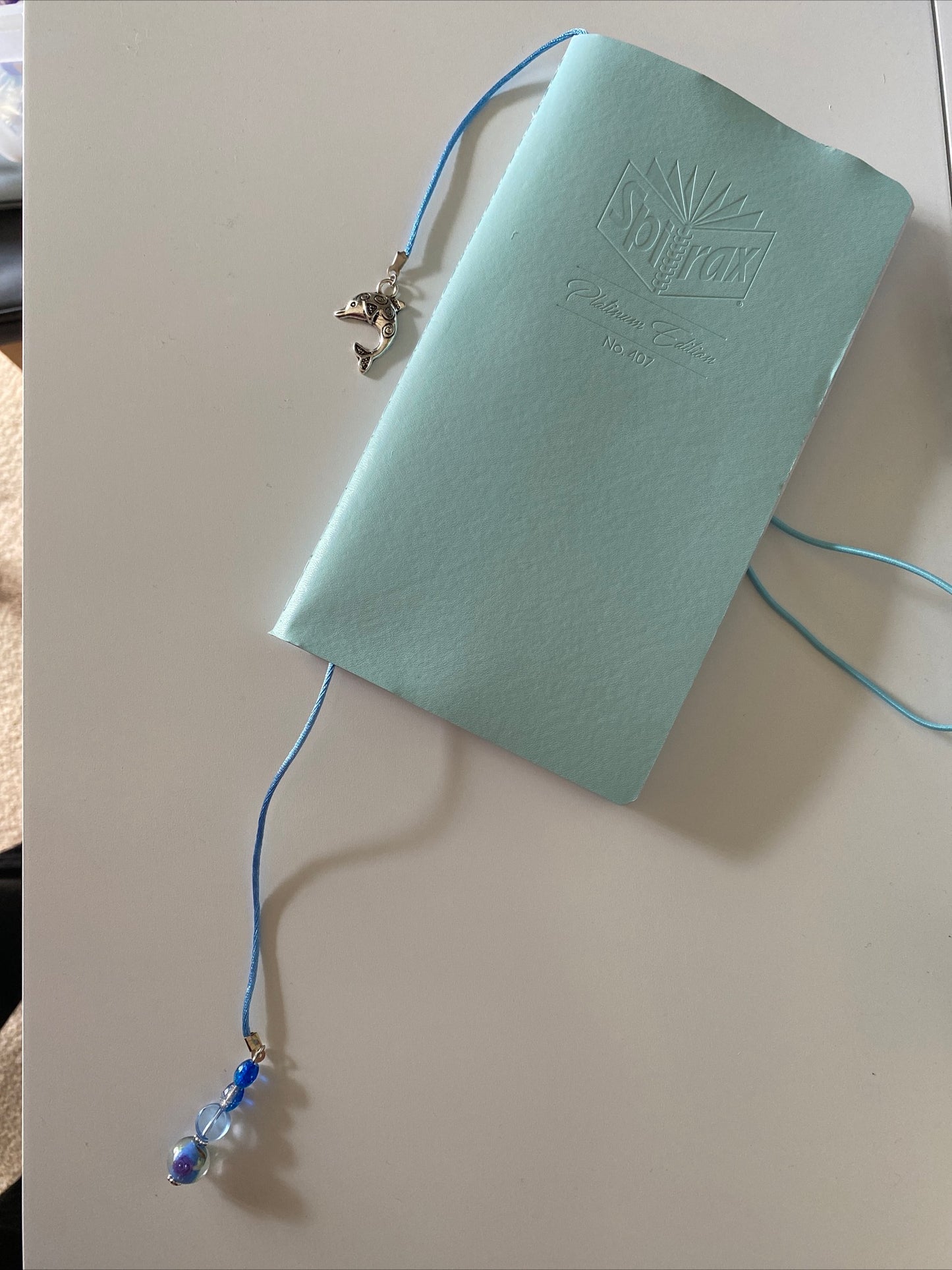 Beaded & Silk Cord Book Mark Book Thong Blue tones Dolphin charm with Blue & Flora lLampwork Bead