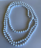 Long Strand White Bead Necklace slide over No Clasp