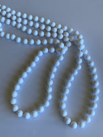 Long Strand White Bead Necklace slide over No Clasp