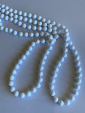Long Strand White Bead Necklace slide over No Clasp